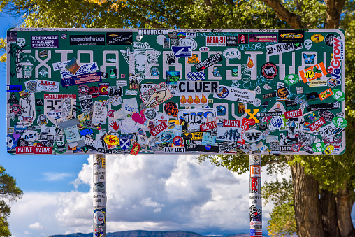 Rachel, Nevada, USA - October 22, 2018 : Road sign for the Extraterrestrial Highway covered with stickers. Close to the Nellis Air Force Range and Area 51, this road is popular among UFO hunters.