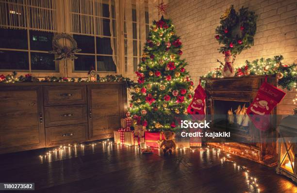 Decorated Christmas Tree Near Fireplace At Home Stock Photo - Download Image Now - Christmas, Backgrounds, Christmas Tree
