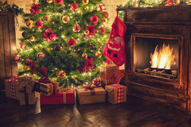 istock Decorated Christmas Tree Near Fireplace at Home 1180273622