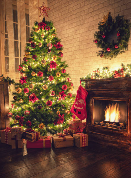 istock Decorated Christmas Tree Near Fireplace at Home 1180273742