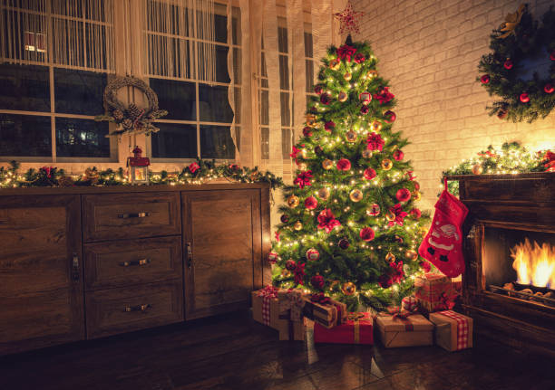istock Decorated Christmas Tree Near Fireplace at Home 1180273811