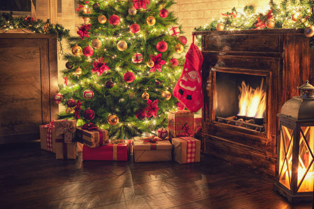 istock Decorated Christmas Tree Near Fireplace at Home 1180273861