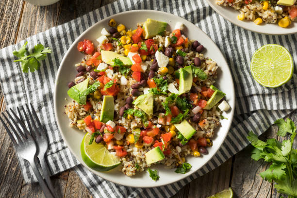 Homemade Mexican Baja Rice Bowl Homemade Mexican Baja Rice Bowl with Avocado and Salsa burrito stock pictures, royalty-free photos & images