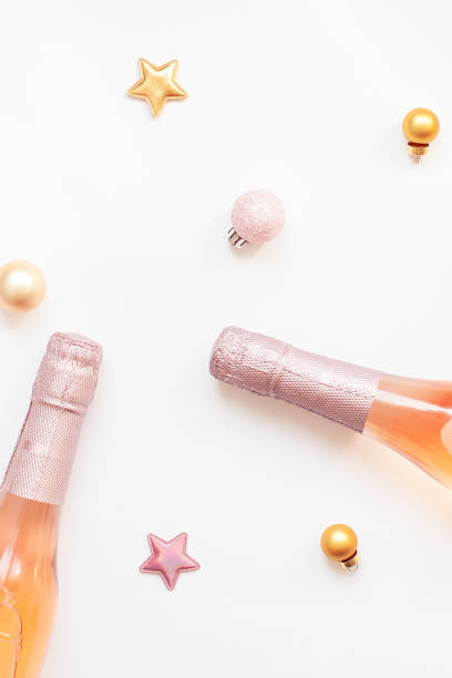 istock Bottles of rose champagne wine on white background 1180276238