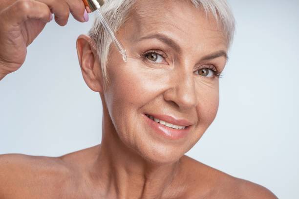 istock Positive delighted senior woman doing beauty procedures 1180277119