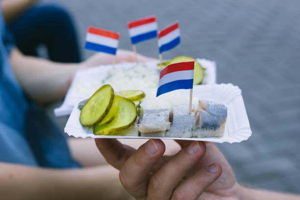 istock herring with onions and pickled cucumbers 1180279417