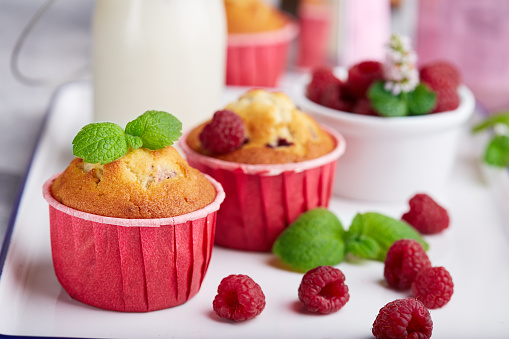 Muffins with raspberries. Delicious homemade sweet dessert. Coffee break