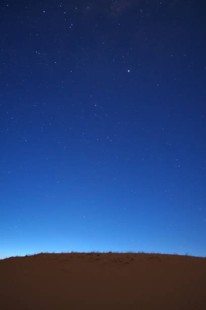 istock Nightfall on the desert. The first stars can be seen in the deep blue sky. 1180281412