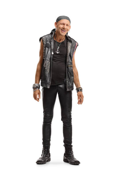 istock Happy punker in a leather outfit smiling at the camera 1180281844