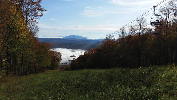 istock Ski lift chairs against beautiful mountain in autumn 1180281929