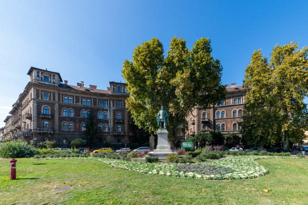 Budapest, Hungary - October 01, 2019: Andrassy Avenue (Hungarian: Andrássy út) is a boulevard in Budapest, Hungary, dating back to 1872. Szondi Gyorgy statue in park.