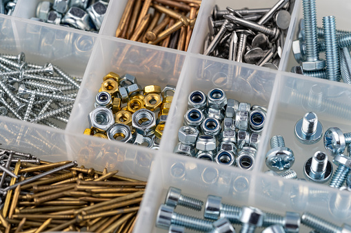 nuts, screws and nails in a toolbox macro view