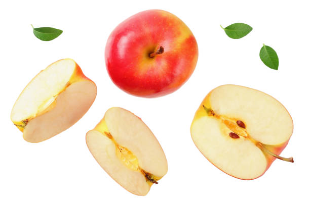 istock red apples with slices and green leaves isolated on a white background. top view 1180288024