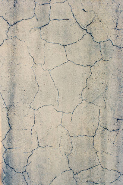istock Grunge abstract background. Cracked old white stucco. 1180297478