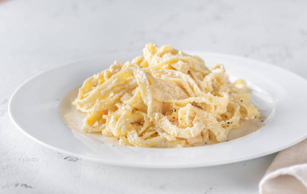 istock Portion of Shrimp Alfredo Pasta 1180297673