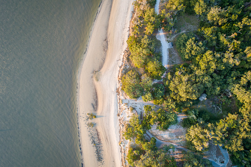 Sea meets sand in this drone view shot directly over Jekyll Island, Georgia's St. Andrews Beach Park.