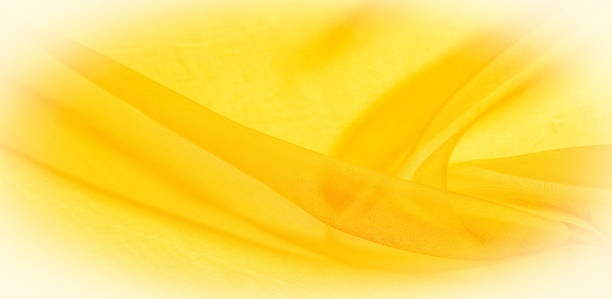 istock Texture of yellow silk fabric. It is also perfect for your design, clothes, posters. Be creative with beautiful project accents. This fabric is inspired by your inspiration. 1180308326