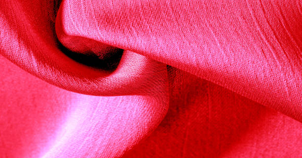 istock Background pattern texture wallpaper, crimson pink silk fabric. It has a smooth matte finish. Use this luxurious fabric for anything - from design to your projects The possibilities are truly endless! 1180308348