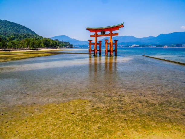 Miyajima, Japan - May 26, 2015: View of the Itsukushima Floating Torii Gate during low tide.