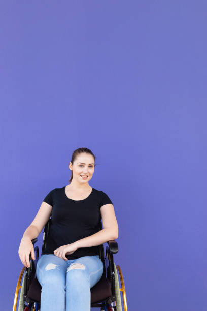 istock Confident Young Disabled Woman In Wheelchair 1180324077