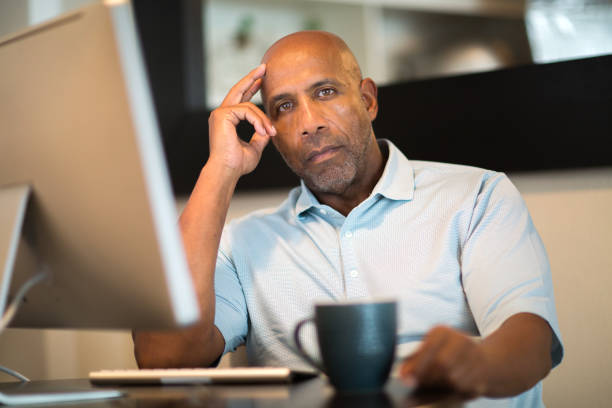 istock Mature African American man looking frustrated. 1180332662