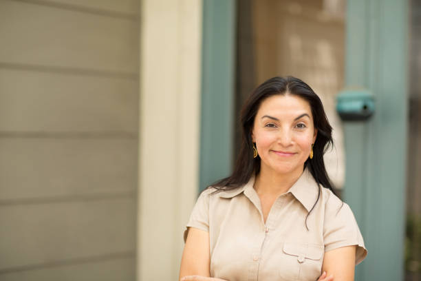 istock Happy Hispnaic woman smiling 1180334508
