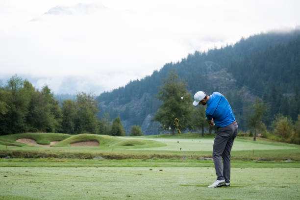 istock Man hits a great golf shot towards the fairway 1180337925