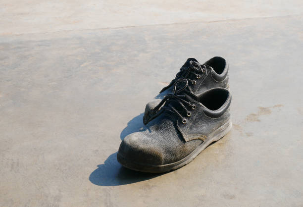 istock Safety shoes, black leather shoes 1180338128