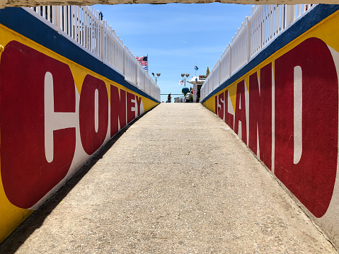 New York, USA - Jun 4, 2019: The Coney Island tunnel under the famous Wonder Wheel late in the day.