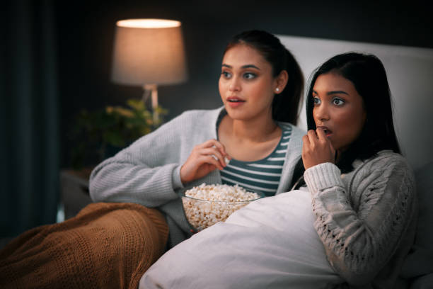 istock Glued to the screen with great entertainment 1180349297