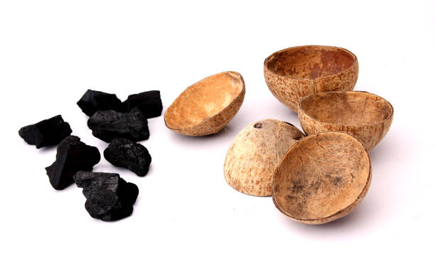 istock coconut charcoal isolated on white background. 1180352707