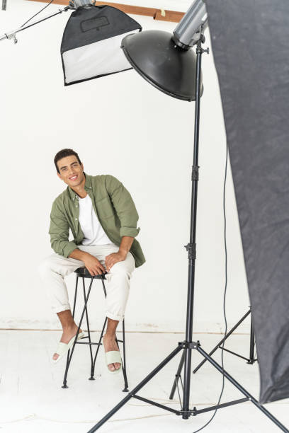istock Cheerful man preparing for his photo session 1180352880