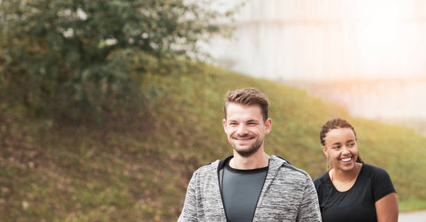 istock Young Multi Ethnic Couple Exercising in Public Park 1180355642
