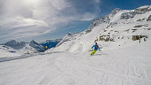 Mölltaler Gletscher - A skier going down a perfectly roomed slope