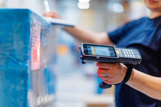 Woman with barcode reader in warehouse stock photo