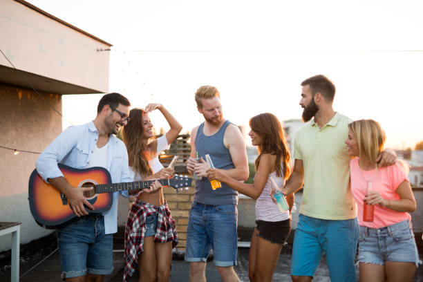 istock Having a great time with friends, havinf fun at rooftop party 1180360542