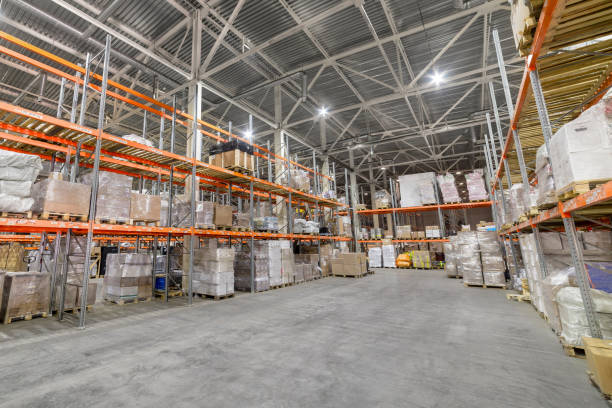 istock Long shelves with a variety of boxes and containers. 1180360832