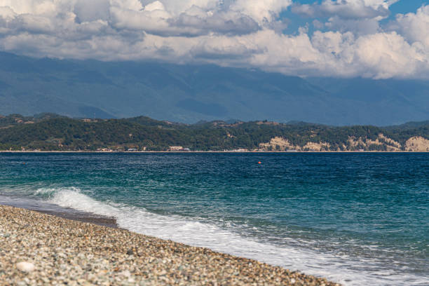 Seascape with blue sky overlooking the shore.