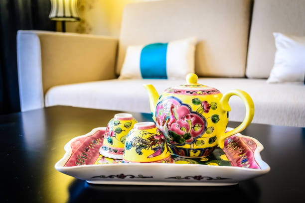 peranakan tea set on a tray on a coffee table in a living room
