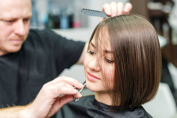 Young Woman And Hairdresser Cutting Hair Tips At Salon Stock Photo -  Download Image Now - iStock