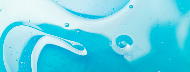 istock Oil bubbles in water, round abstract drops 1180364691