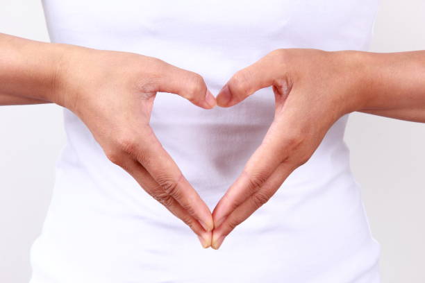 istock Woman hands in heart shape 1180365855