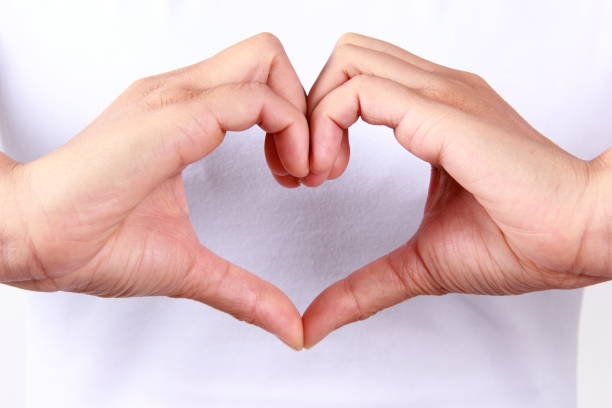 istock Woman hands in heart shape 1180365865