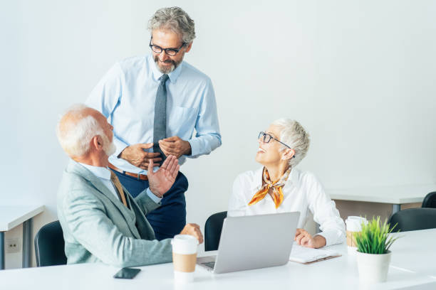 istock Senior business people having a discussion 1180366748