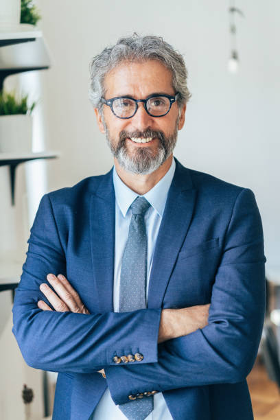 istock Confident and smiling businessman 1180366763