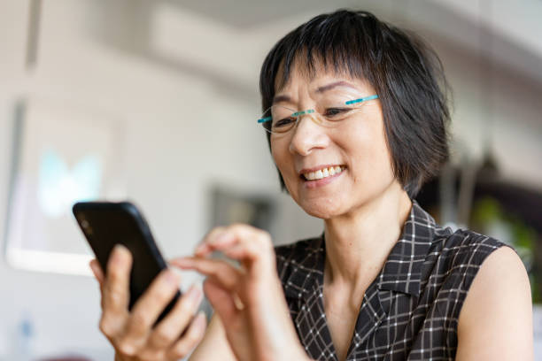 Senior Asian woman using a smartphone