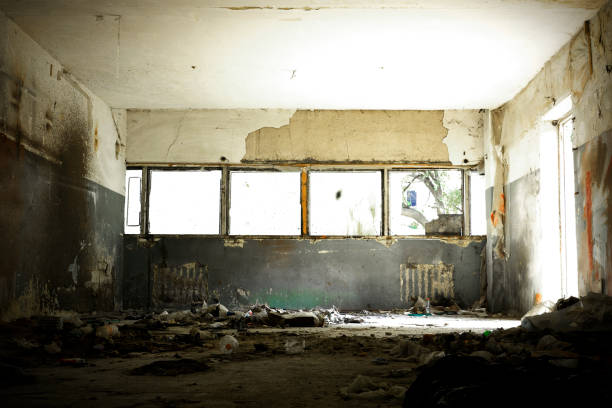 istock Abandoned building interior. Partially ruined warehouse building from the Post Soviet era. 1180369229