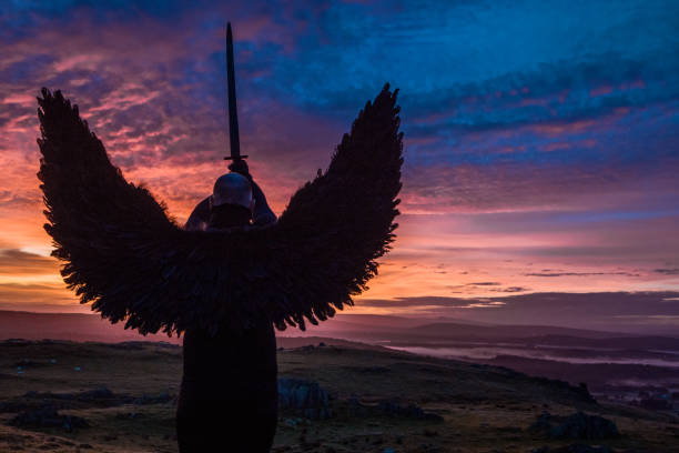 istock Black Winged Warrior Angel at dawn 1180375537