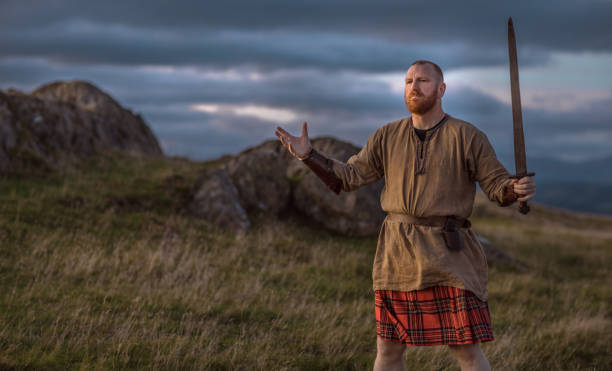 istock Scottish Redhead Warrior wearing a kilt 1180378407