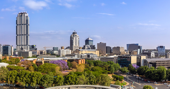 Sandton City panorama at daytime with the Leonardo building, Michelangelo apartments and sandton city office towers.\nSandton has become home to most of the major financial, consulting and banking firms in South Africa.  Sandton houses approximately 300000 residents and 10 000 businesses, including investment banks, top businesses, financial consultants, the Johannesburg stock exchange and one of the biggest convention centres on the African continent, the Sandton Convention Centre.